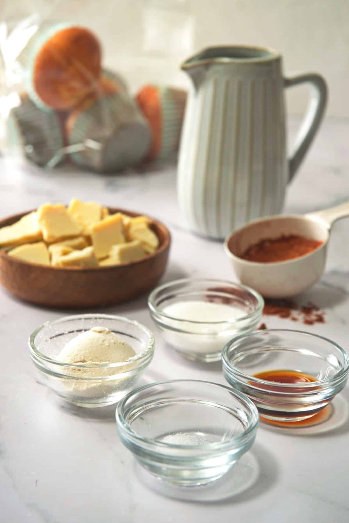 Chocolate gravy ingredients prepped on marble background.