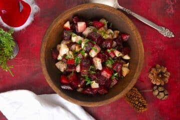 Roasted beets and turnips in wooden serving bowl.