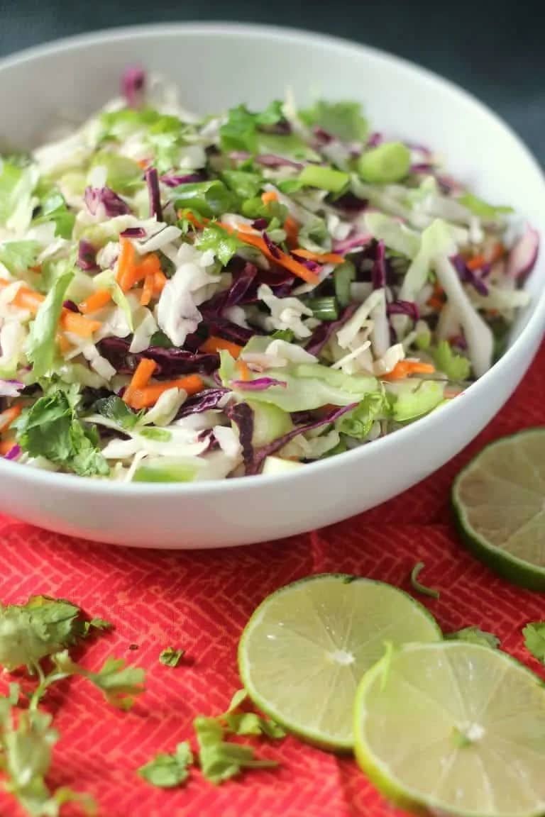 Coleslaw in white bowl.