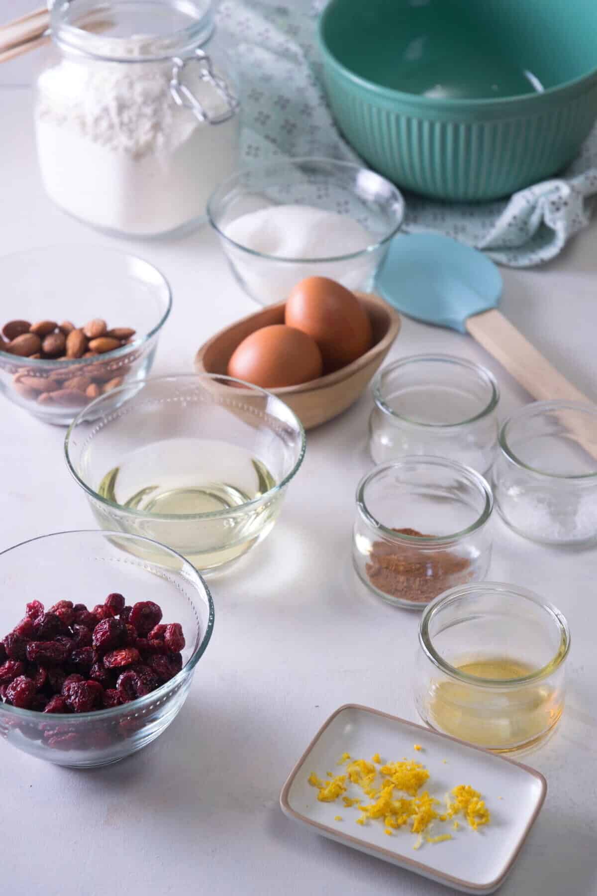 Cranberry biscotti prepped ingredients on light background.