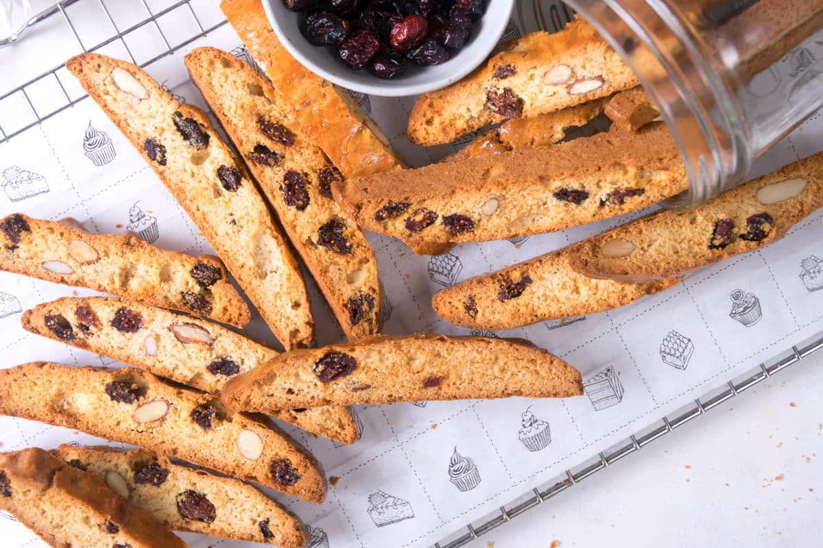 Cranberry biscotti laid out on baking rack.