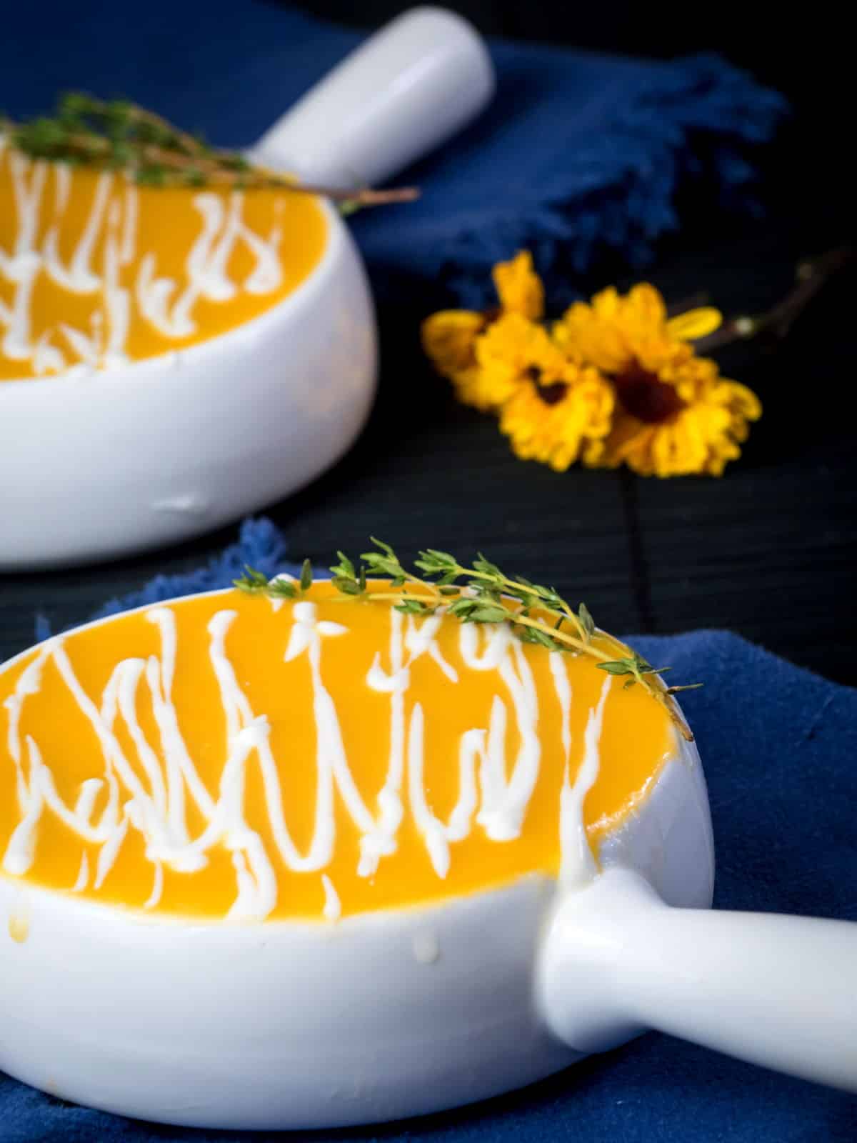 Pumpkin soup in white porcelain soup bowl.