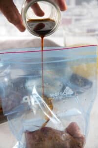 A ziptop bag with pork tenderloin and marinade.