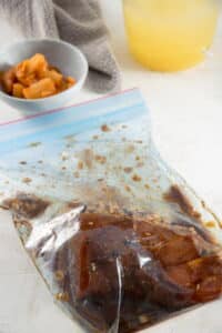A ziptop bag with pork tenderloin and marinade.