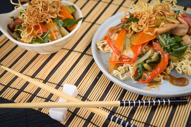 Crunchy chow mein noodles with chopsticks.