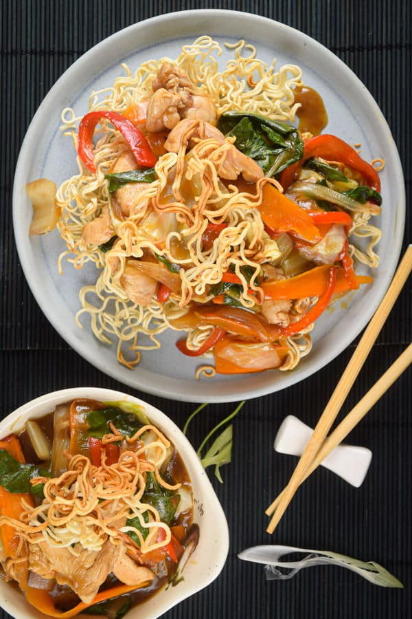 Crunchy chow mein noodles with chopsticks.