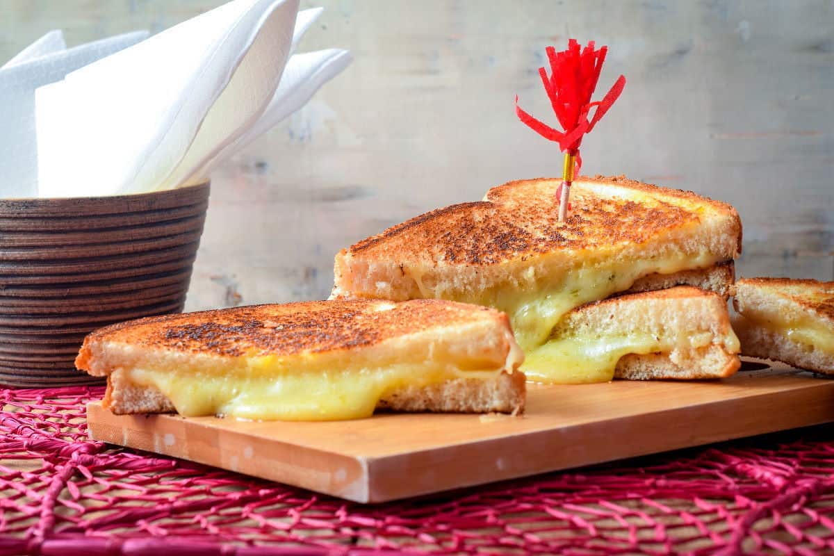 Grilled cheese sandwich being grilled in frying pan Stock Photo