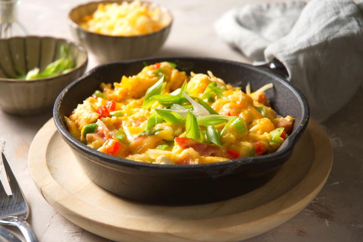 Scrambled eggs in cast iron pan.