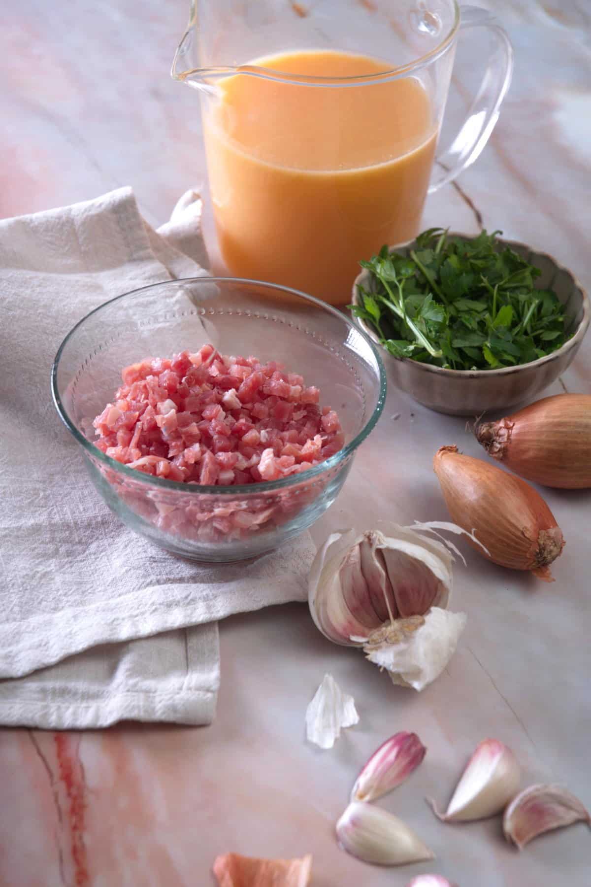 Ham gravy prepped ingredients on marble background.