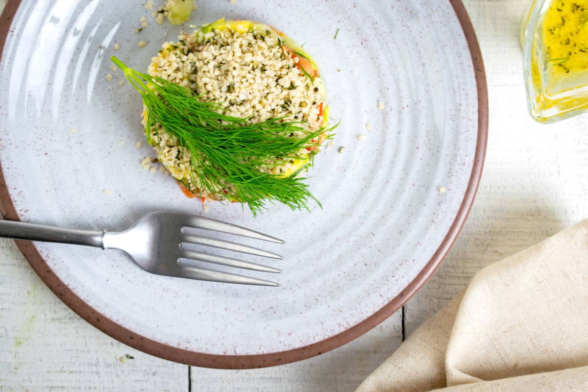 Hemp Seed Salad on a plate with dill sprig.