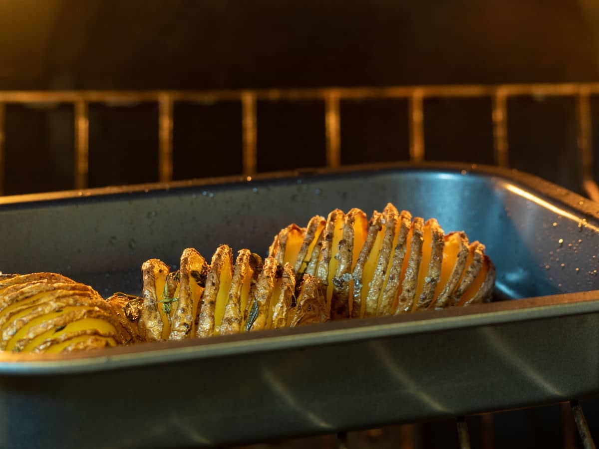 Hasselback potatoes baking in the oven.