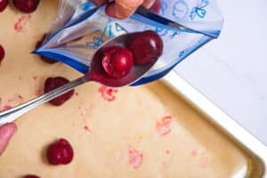 Fresh cherries on spoon with zip top bag.
