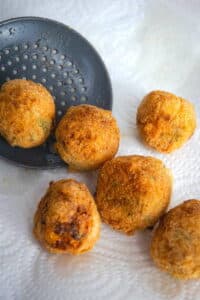 Fried corn nuggets on paper towel.