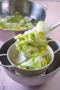 Chopped Napa cabbage in a colander.