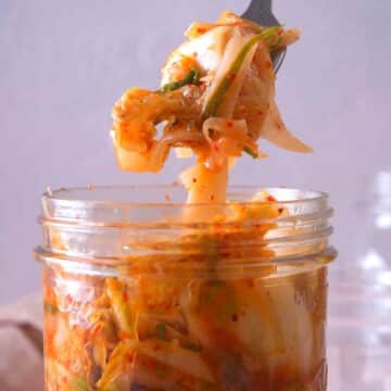 Kimchi in a jar and on a fork.