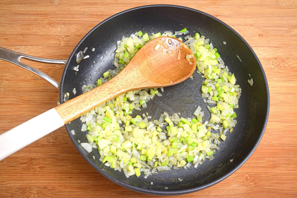 Diced onions and celery in frying pan.