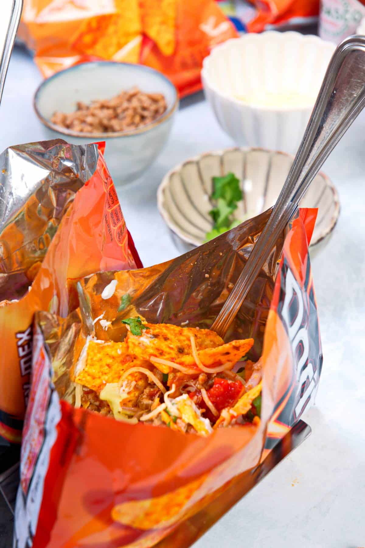 Taco in a bag with a fork.