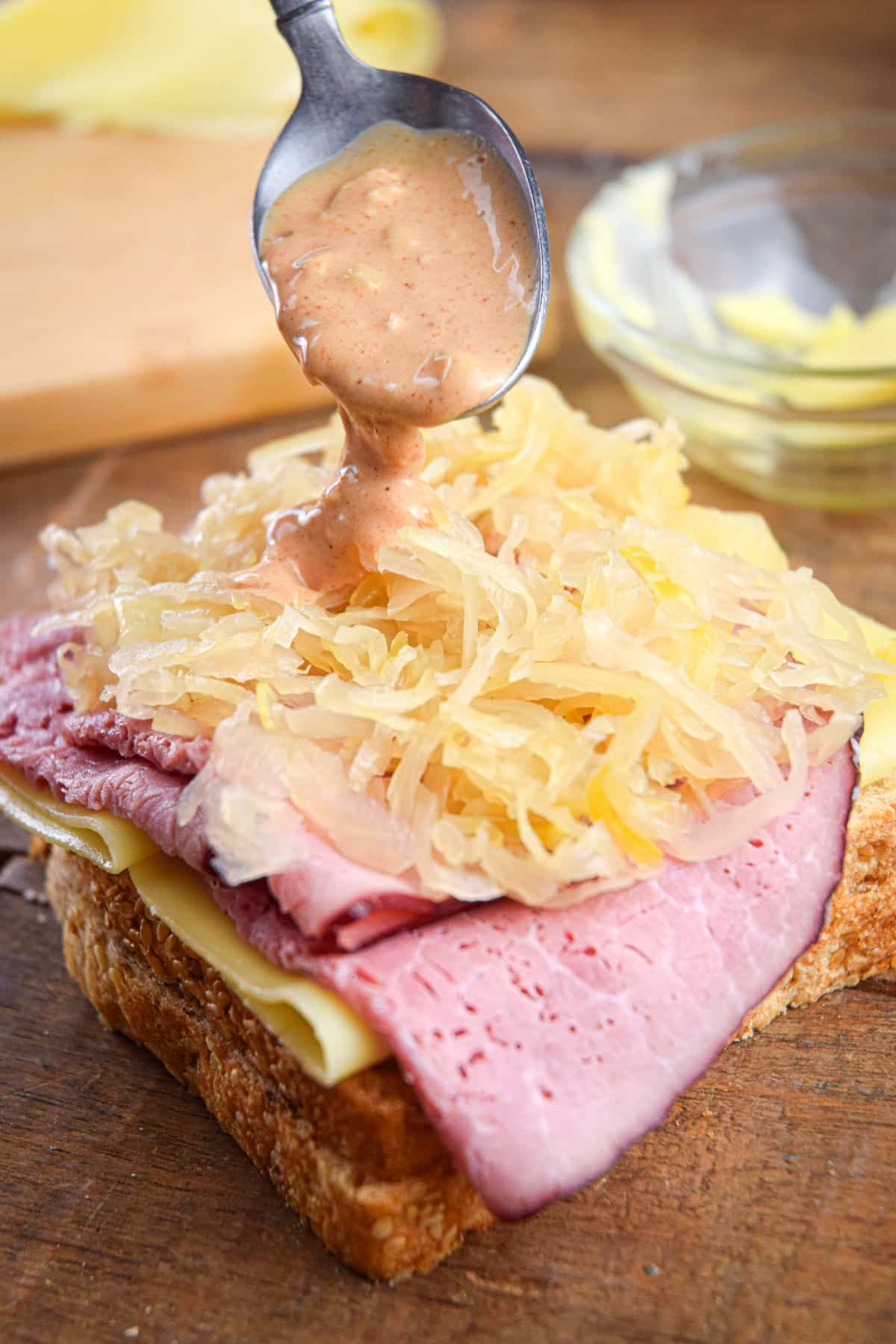 Sauerkraut, corned beef and Swiss cheese on bread.