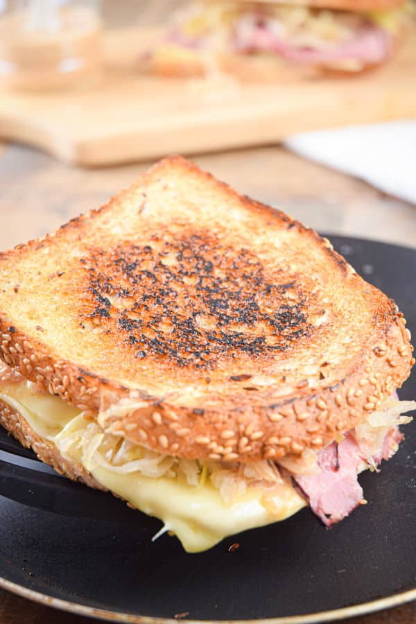 Reuben sandwich in a frying pan.