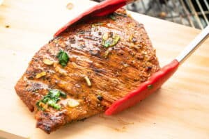Carne asada on cutting board.