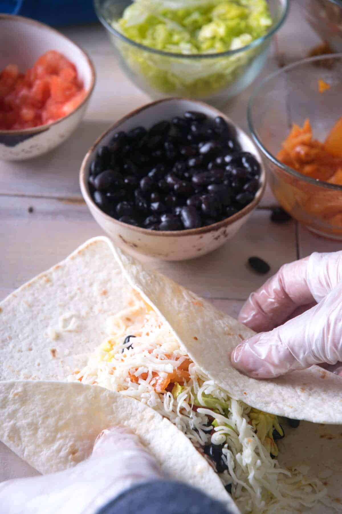 Tortilla with burrito ingredients.