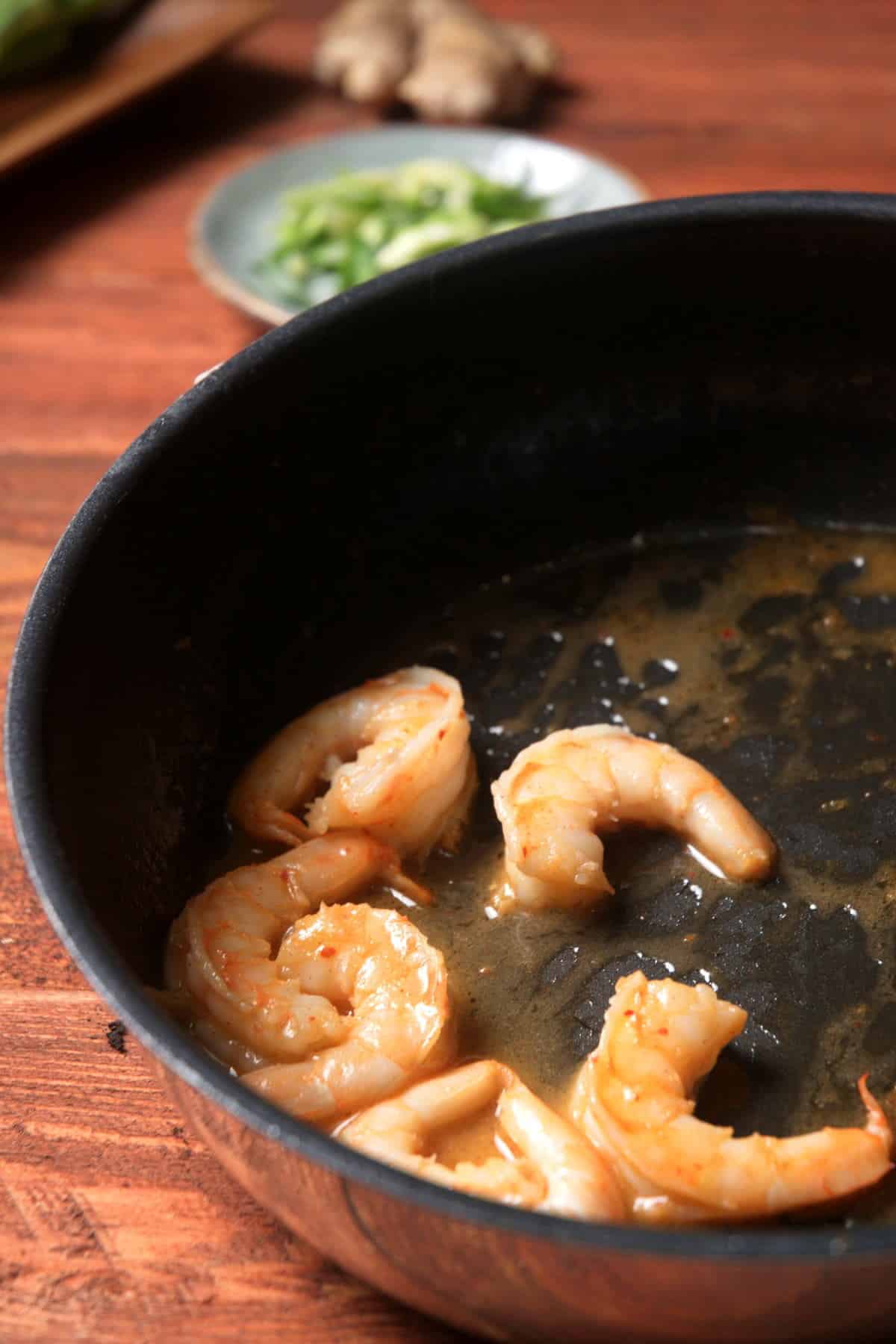 Shrimp cooking in a frying pan.