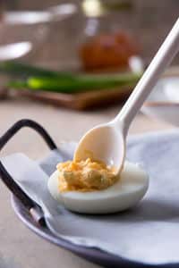 Cooked egg white with egg yolk mixture in the middle.