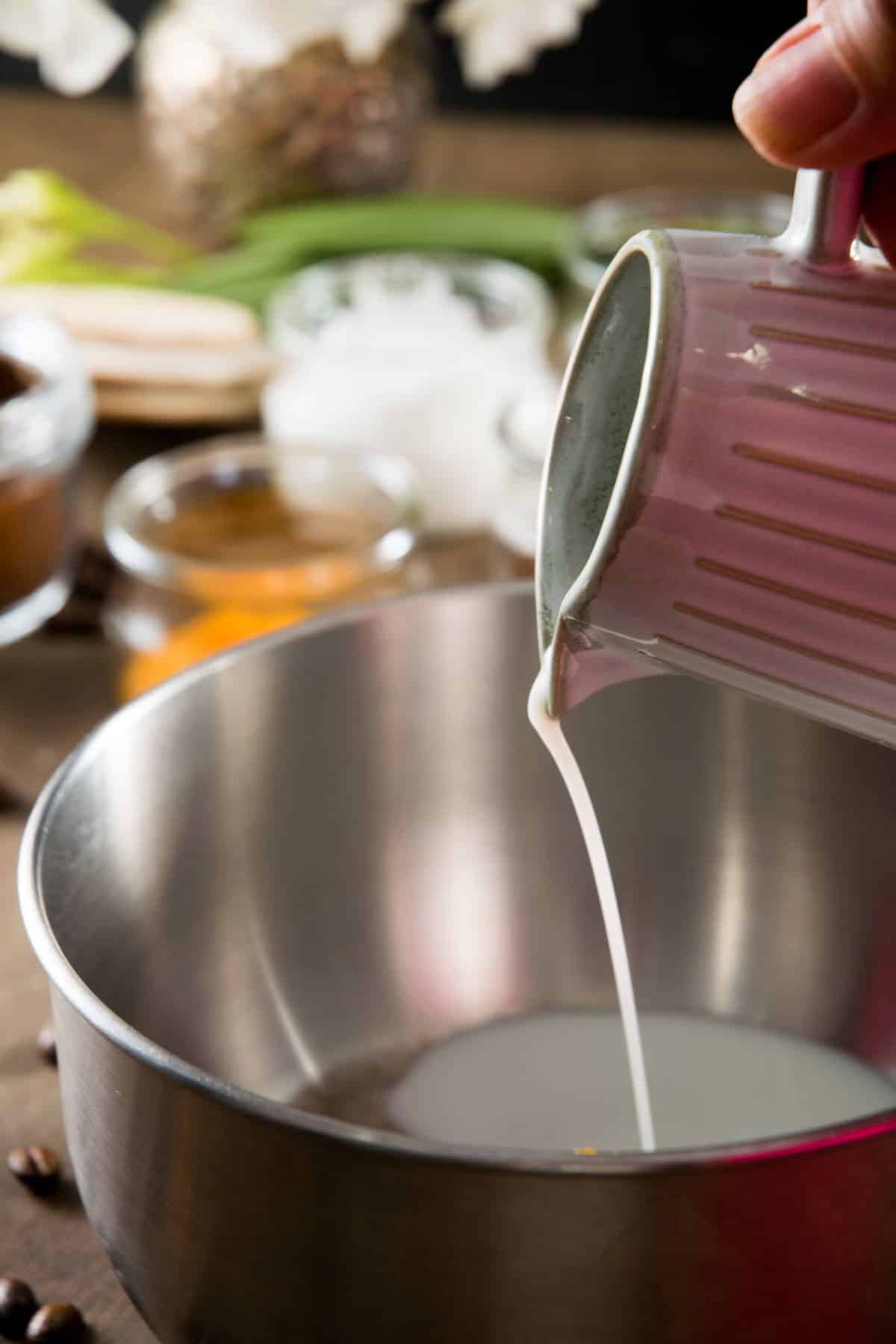 Milk pouring into a saucepan.