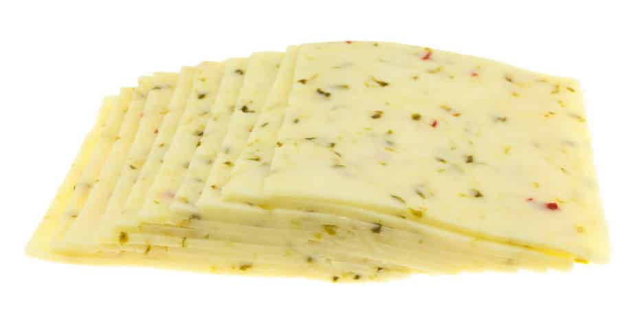 Pepper Jack cheese slices on white background.