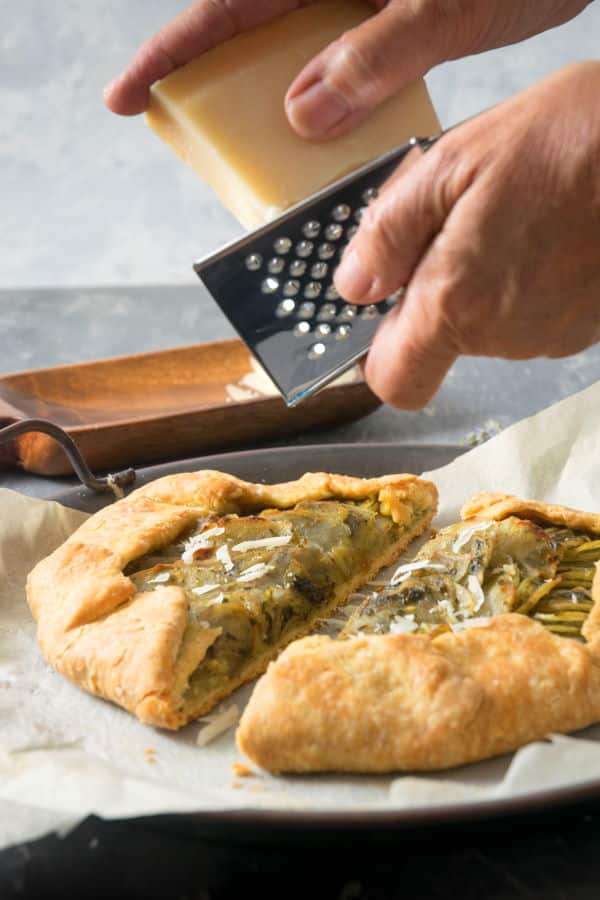 Baked potato galette with grated Parmesan cheese.