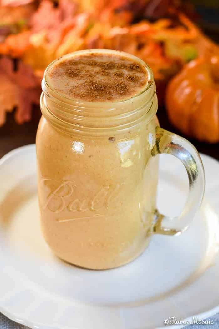 Pumpkin smoothie in a glass jar.