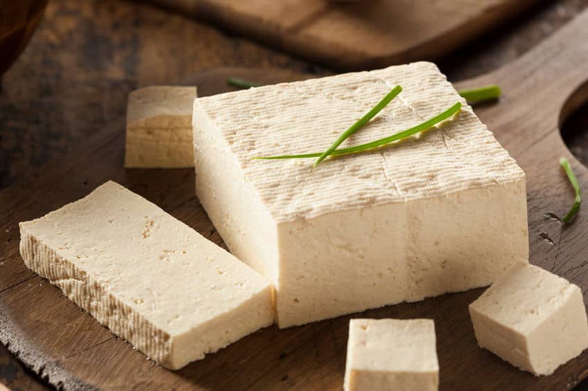 Organic Raw Soy Tofu on a Wooden Background