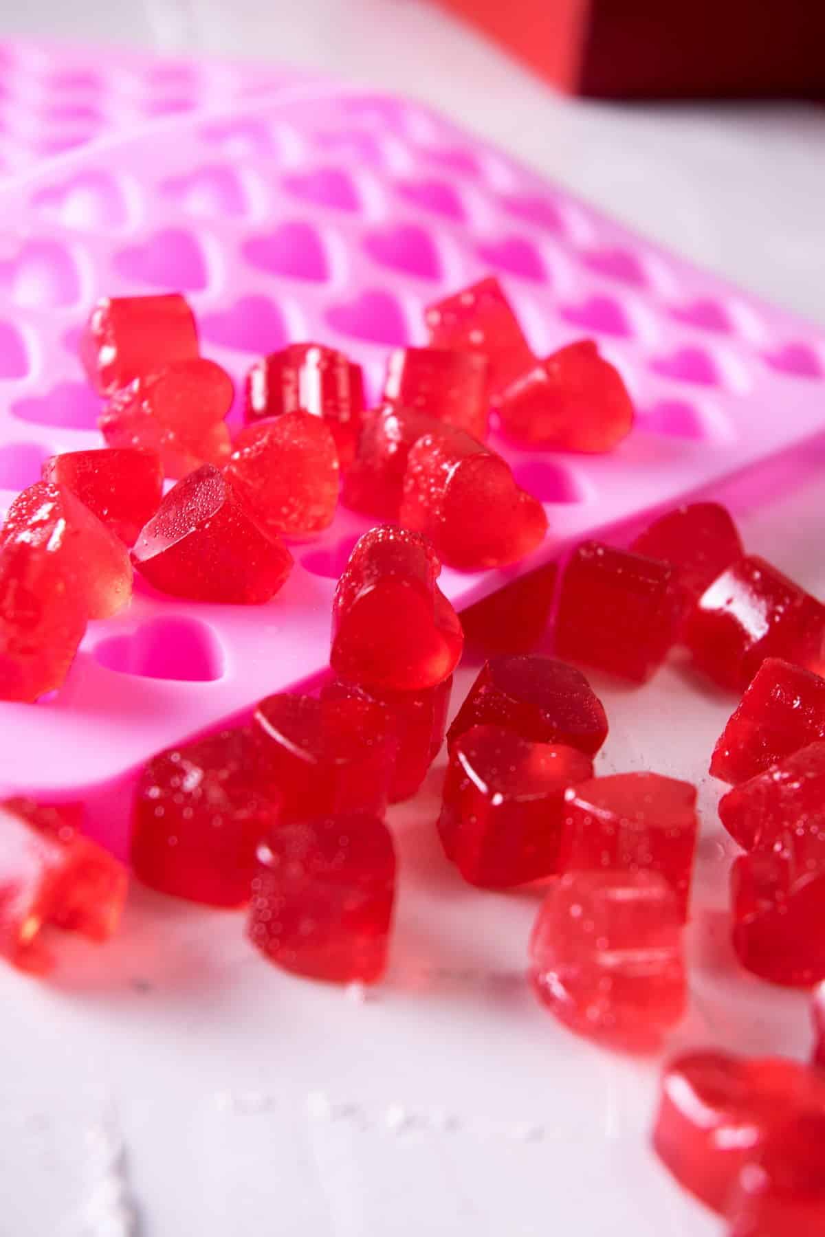 Strawberry heart candies in a pink heart mold.