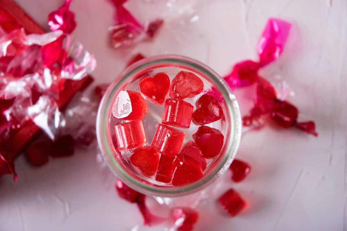 Strawberry hard candies in a jar.