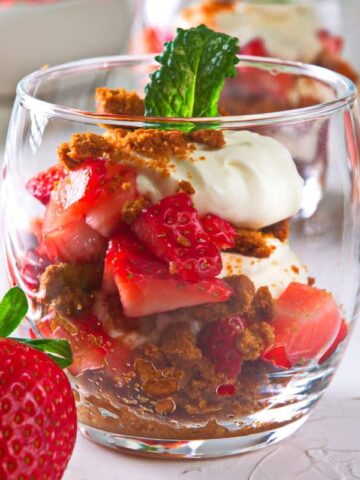 Strawberry parfait in a wine glass close up.