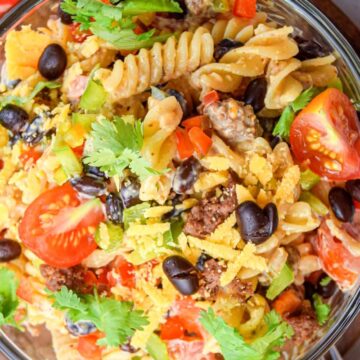 Taco pasta salad in a clear bowl.