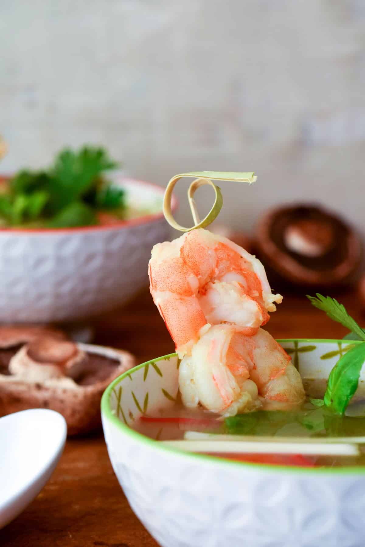 Tom Yum Soup in a porcelain bowl.