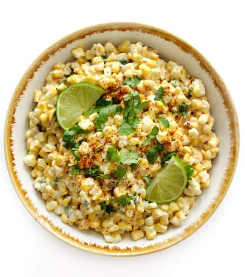 Corn salad in a bowl isolated on white background.