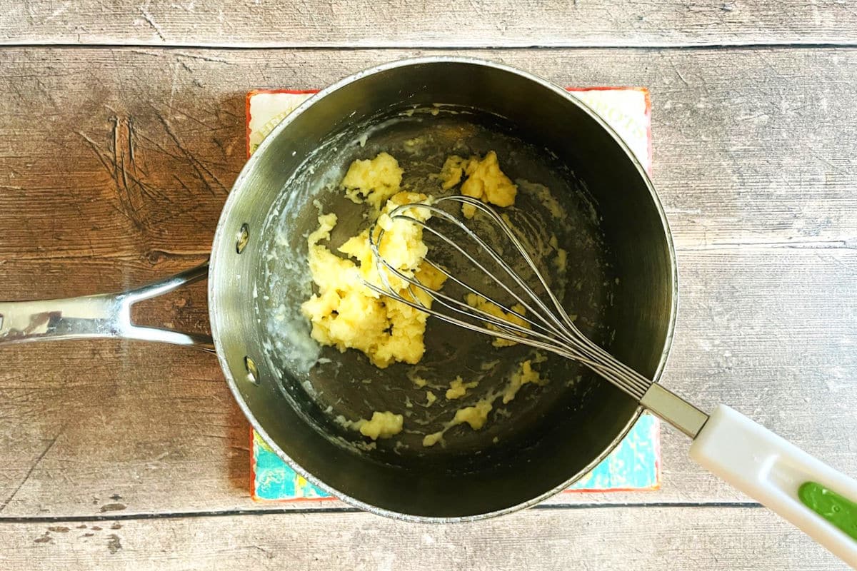 Beer cheese sauce roux in saucepan.