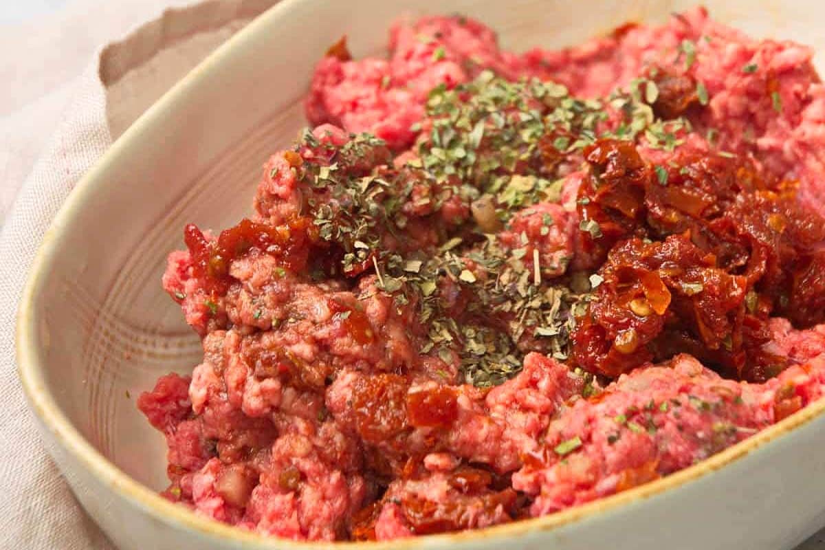 Raw, ground bison burger mixture.