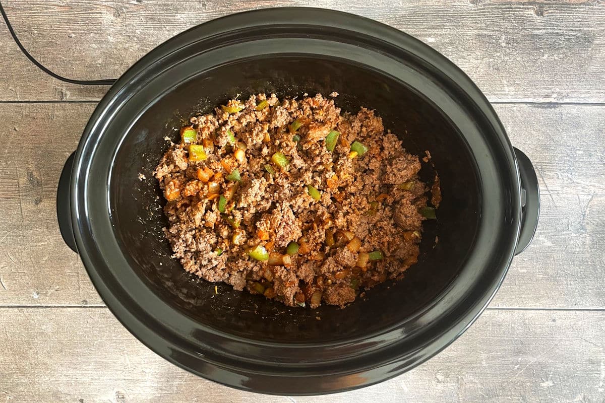 Cooked ground bison and veggies in slow cooker.