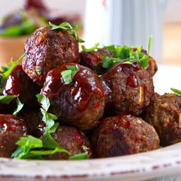 Bison meatballs with BBQ sauce and parsley.