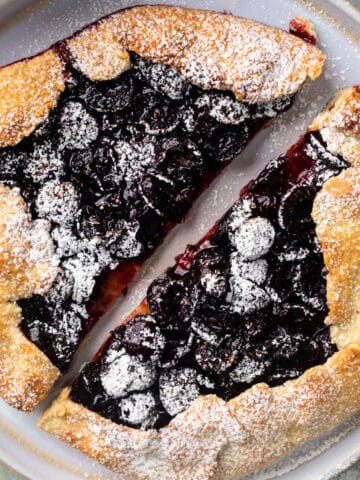 Cherry galette dusted with icing sugar.