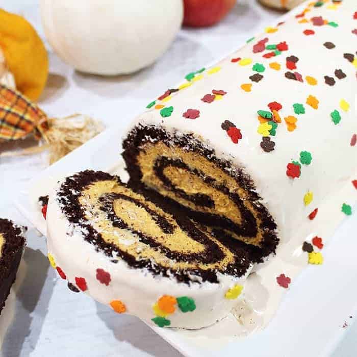 White swiss roll cake with sprinkles.