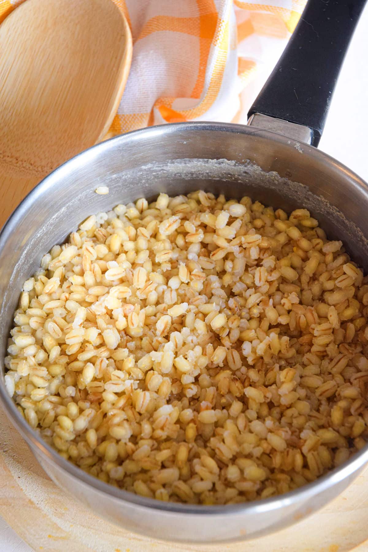 Cooked pearl barley in pot.