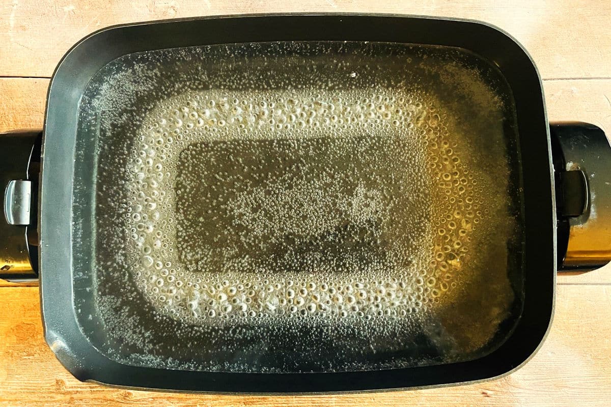 Boiling water in electric skillet.