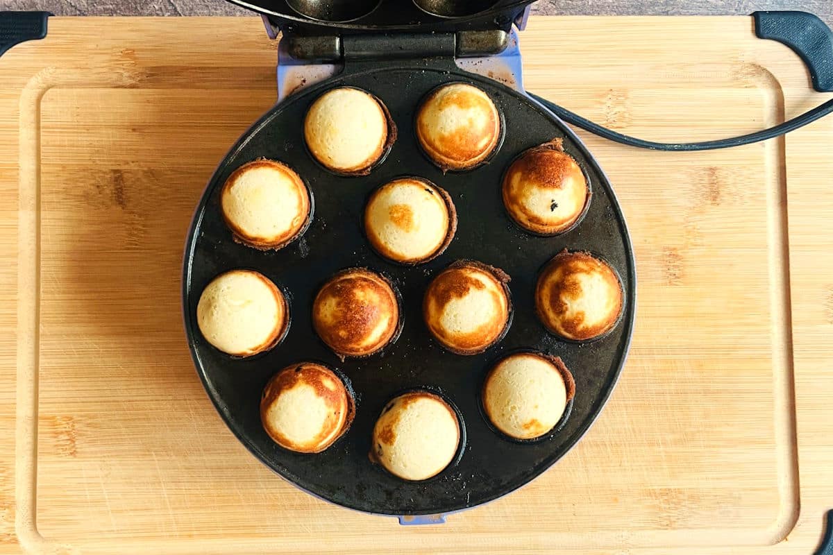 Cranberry white chocolate cake balls in cake pop maker.