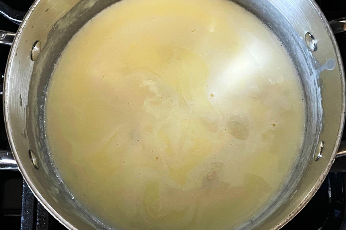 Cheese sauce in saucepan.