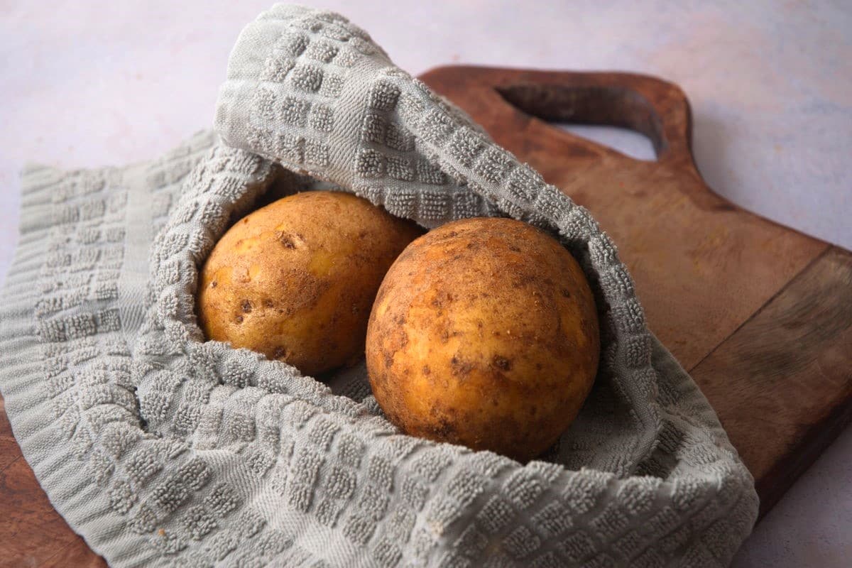 Potatoes in kitchen towel.
