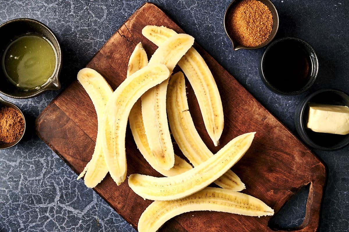 Sliced bananas on cutting board.